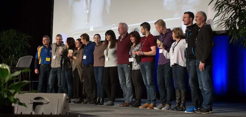 Rule #1 Investment Workshop students lined up on stage